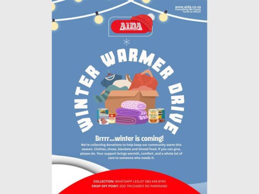a banner carrying information about a winter warmer drive