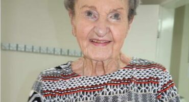 an elderly person knitting