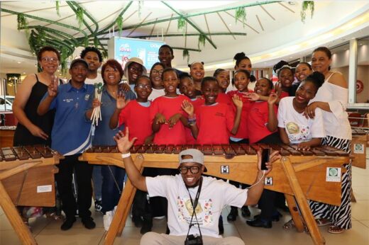 A group of people including adults and school children