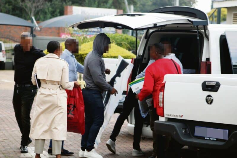 a group of officers confiscating firearms
