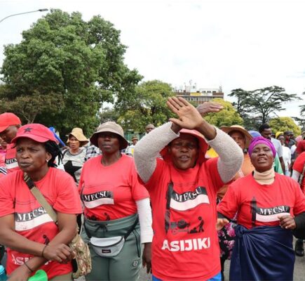 A group of protesting women all in red t-shirts