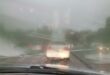 Cars push through heavy rainfall