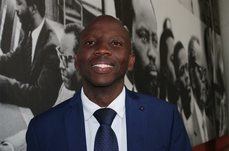 a black man in blue suits