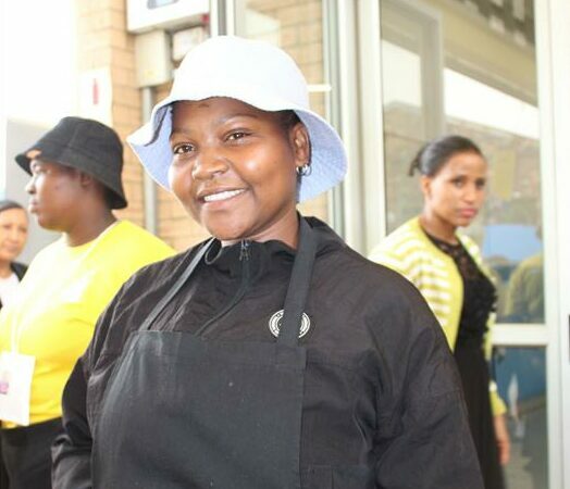 a woman wearing black bib apron
