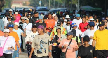a large crowd of people walking down the street