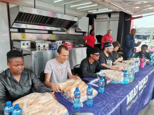 a group of people and hot dogs 