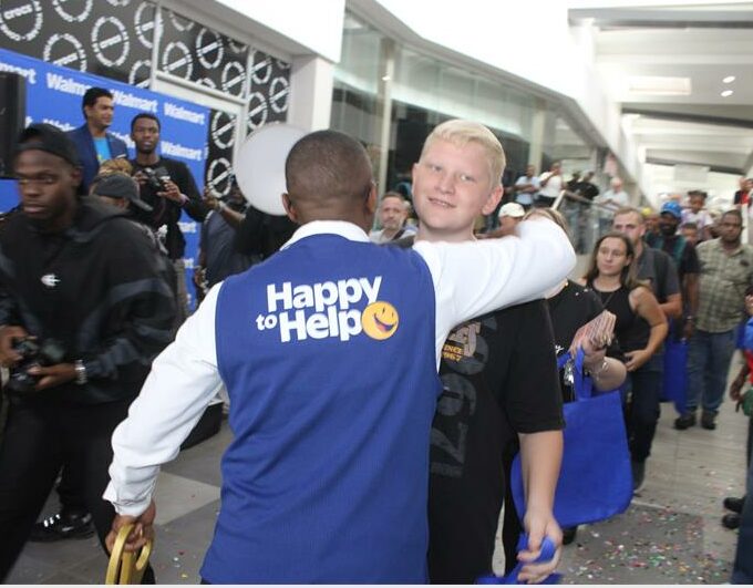 a man hugging a boy