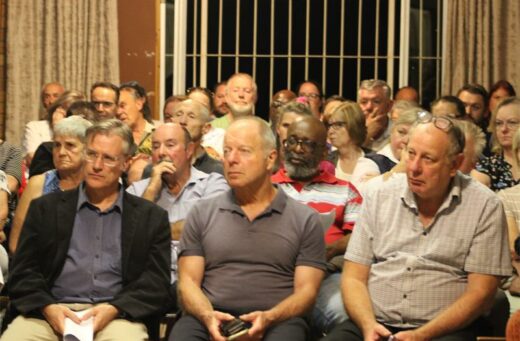 a group of people sitting in a hall