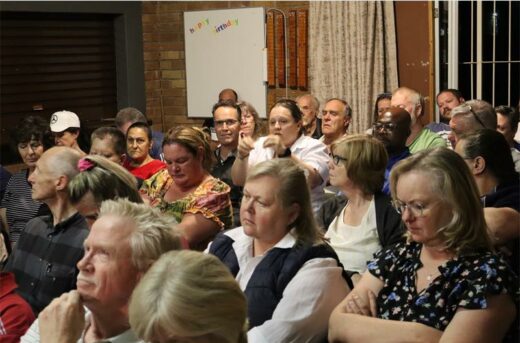 a group of people in a hall