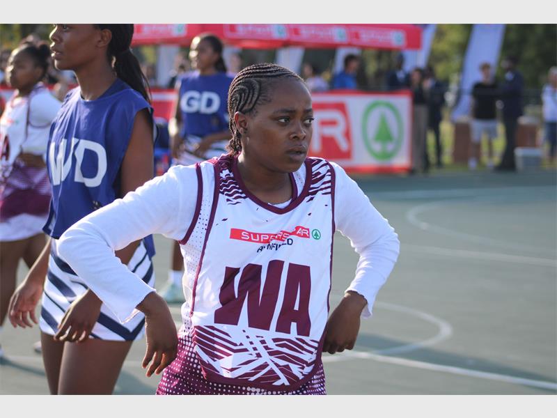 a girl in her netball attire