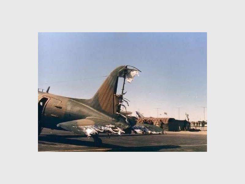 A photo showing the damage to the tail of a Dakota aircraft.