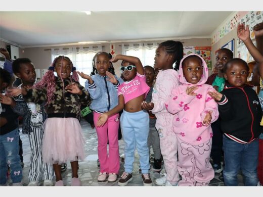 a group of children in colourful outfits 
