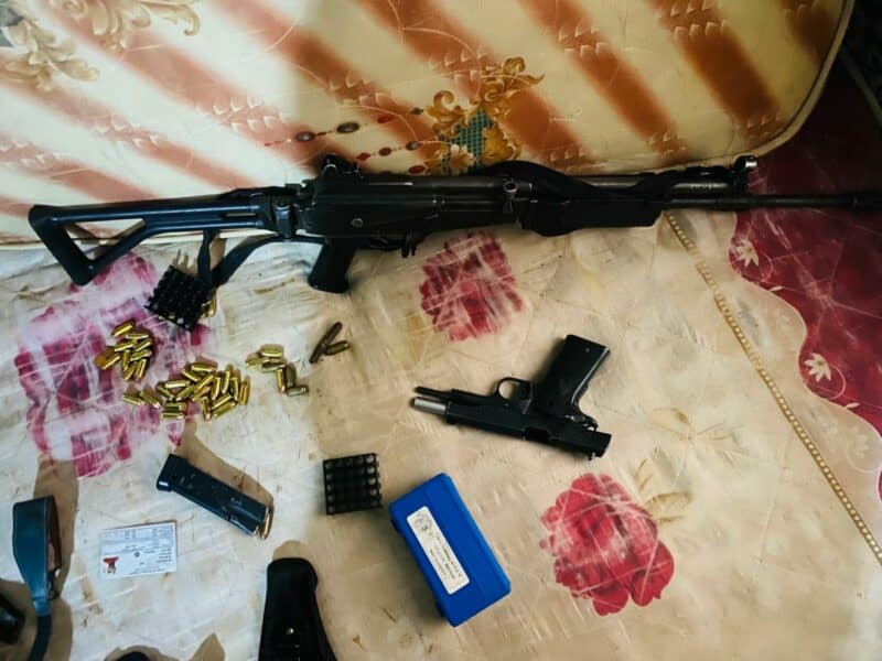 a rifle, pistol and gamazines and live ammunition