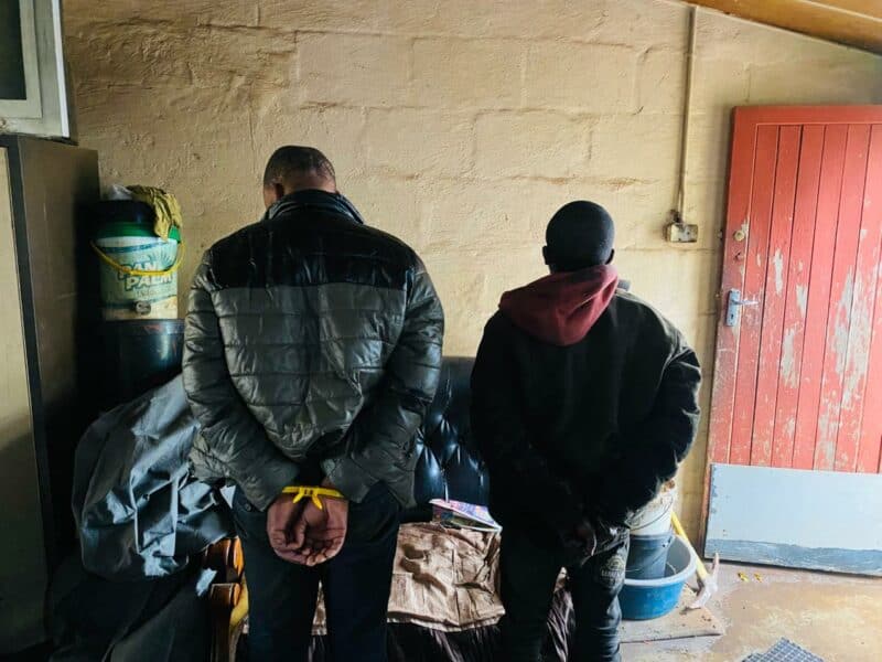 Two men in handcuffs