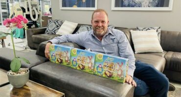 a man with a selection of Easter egg boxes