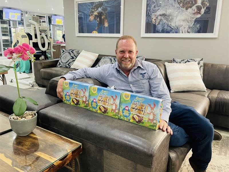 a man with a selection of Easter egg boxes