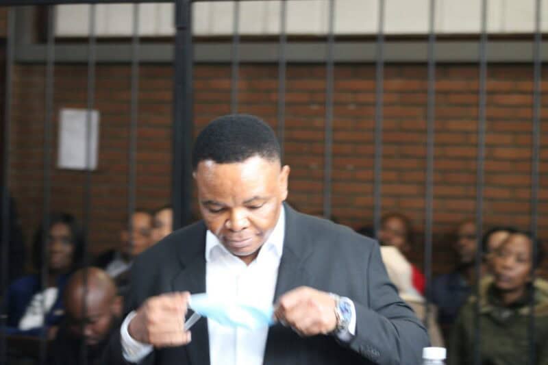 a man standing in the court dock