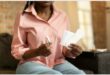 A lady holding sanitary products.