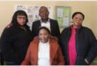 A GROUP PHOTO WITH THREE WOMEN AND ONE MAN