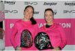 Two women with padel rackets