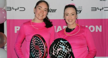 Two women with padel rackets