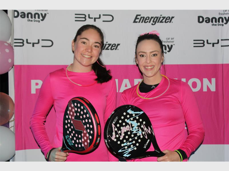 Two women with padel rackets