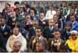 A hall full of learners taking part in a spelling bee.