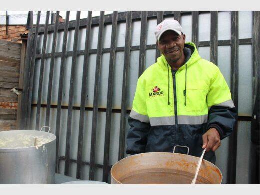 A man dishing up meals