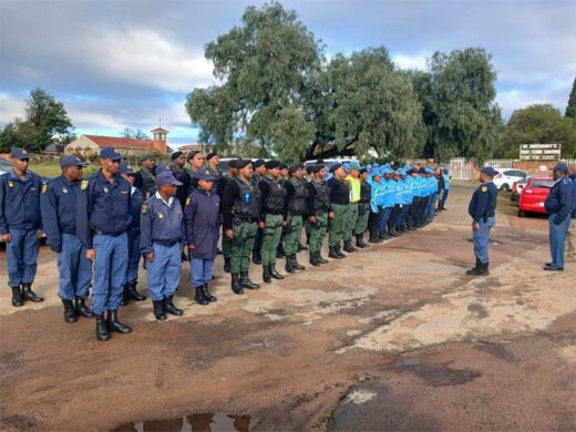 multi-agency safety team gather in formation during a parade briefing