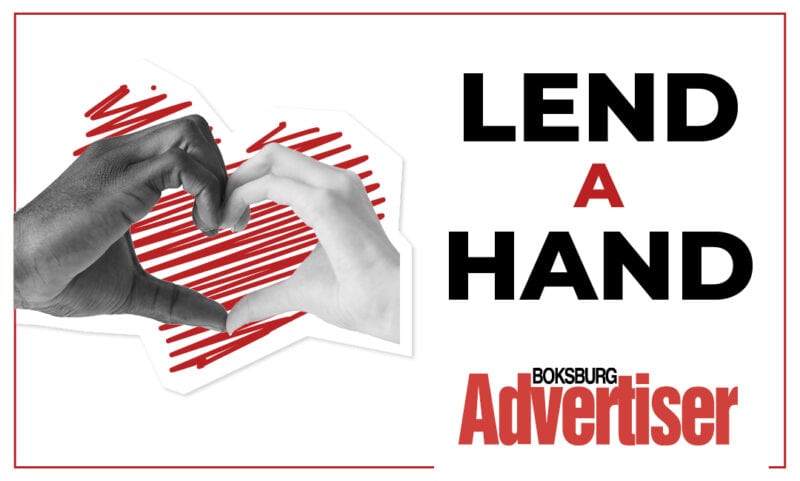 A black and white image with the words Lend a Hand and the Boksburg Advertiser logo in the bottom right hand corner and an image of hands forming a heart.