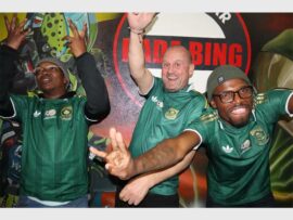 three men in bafana bafana shirts