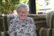Elderly woman smiling at the camera