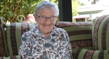 Elderly woman smiling at the camera