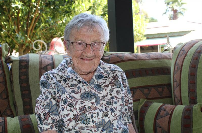 Elderly woman smiling at the camera