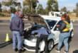 police officers inspecting a motor vehicle