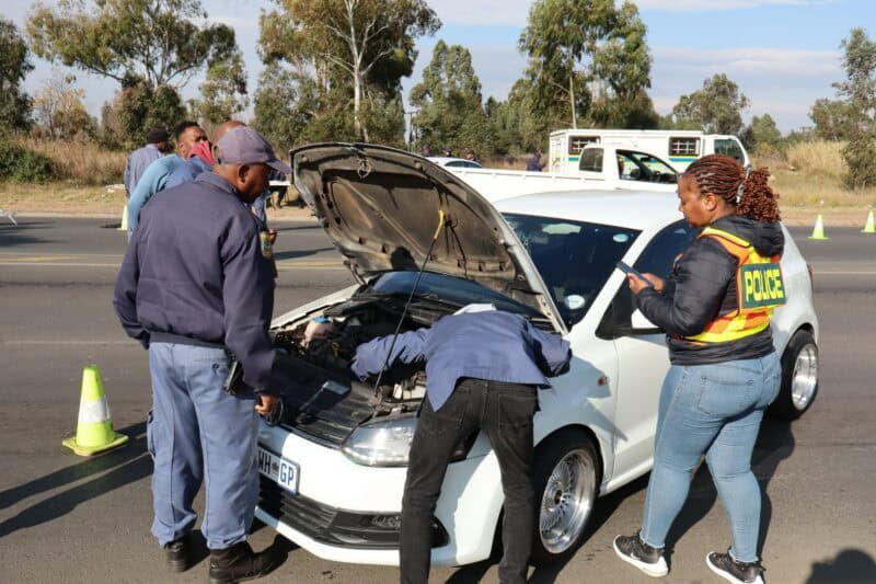 police officers inspecting a motor vehicle
