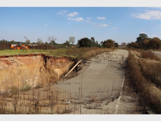collapsed road and sinkhole