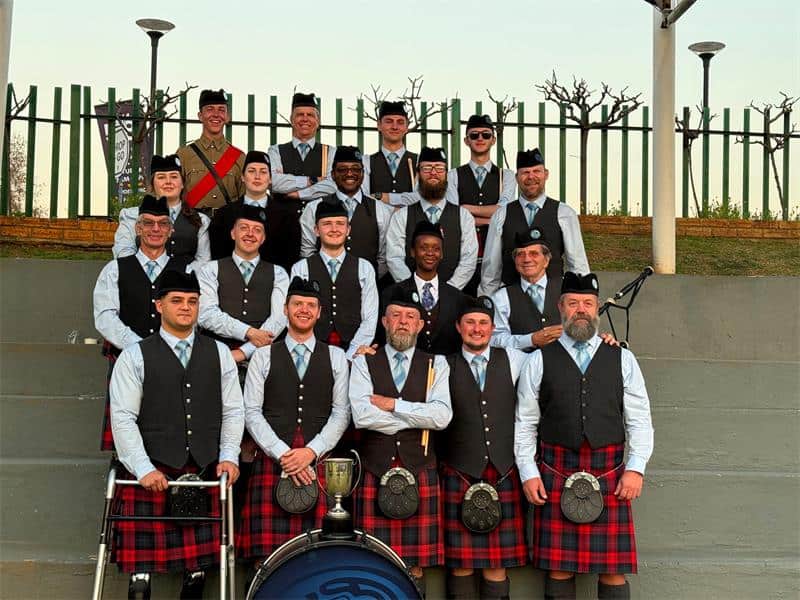 Group of adults wearing kilts