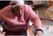 Lady in a pink top making a mat.