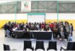 A big group of teachers sitting in a hall.