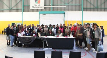 A big group of teachers sitting in a hall.