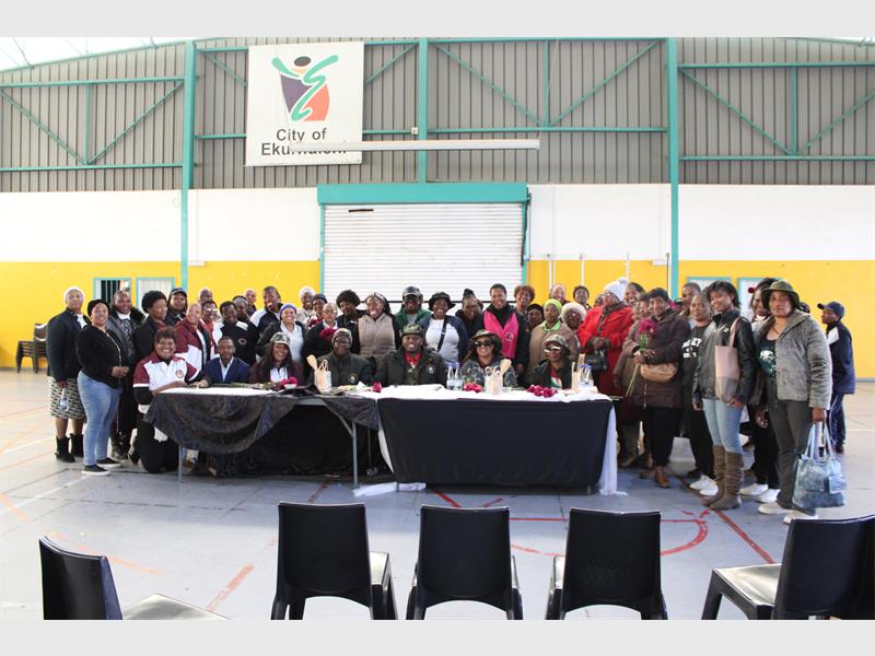 A big group of teachers sitting in a hall.