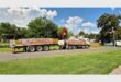 A view of a truck transporting bricks parked in a residential suburb.