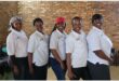 a group of women in white t-shirts