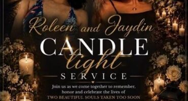 A poster invited the community to a candlelight vigil for two women, showing their photographs and giving the information.,