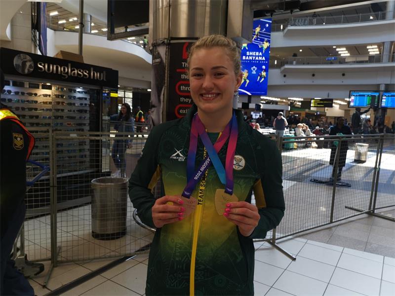 She defended her 50m breaststroke title and added a 4x100m medley relay bronze to end the games with two medals.