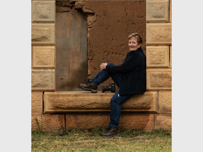 a woman sitting in the veranda
