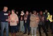 a group of people during a candlelight ceremony