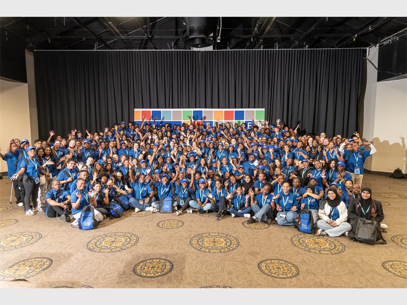 Learners in blue jeans and blue tops