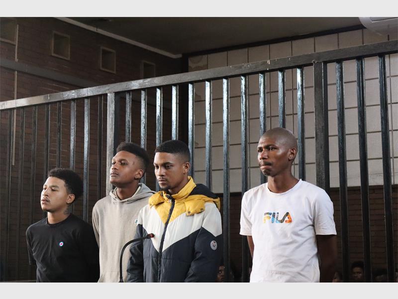 The bail proceedings of four men accused in connection with the deaths of two civilians and two Anti-Gang Unit officers have been postponed, while one accused also faces scrutiny over an alleged cellphone incident in prison.